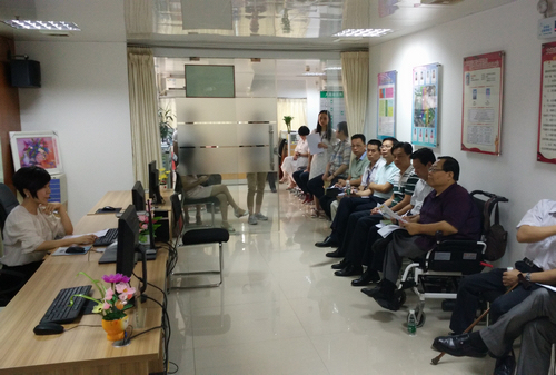 图为吕世明到广东省调研残疾人工作